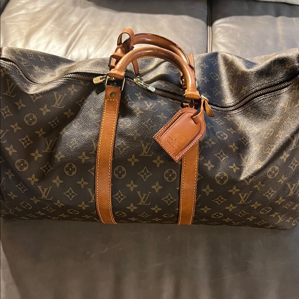 Louis Vuitton Monogram Keepall. Black and Brown Duffel Bag. Dust bag